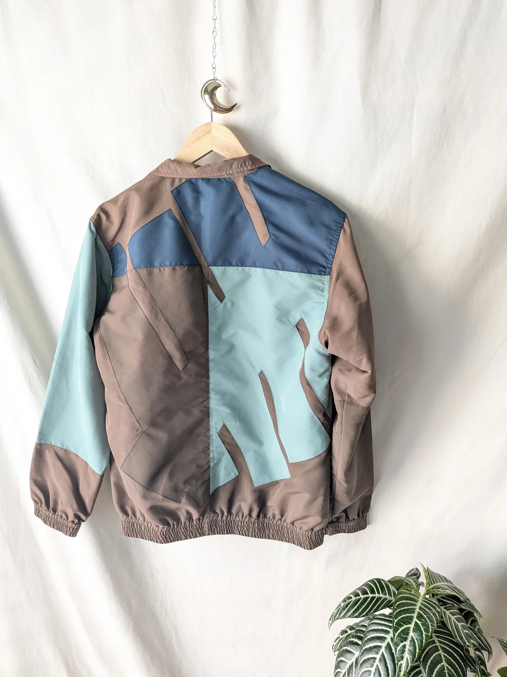 Undefeated Jacket in Taupe and Beige with Blue Logo Tag